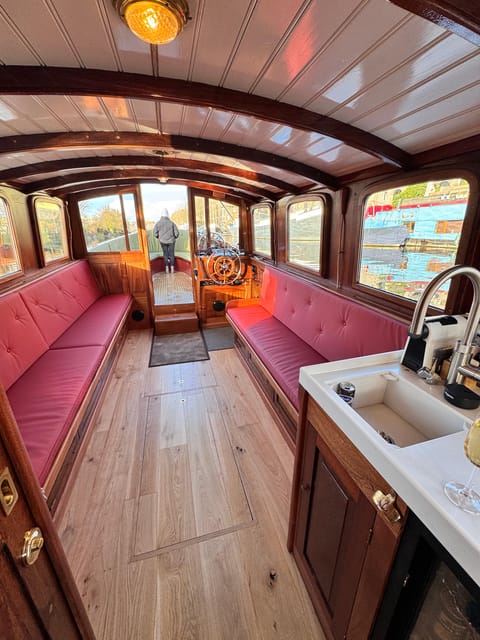 Amsterdam: Historic Boat Cruise with open bar and nibbles - Indoor comfort and outdoor views