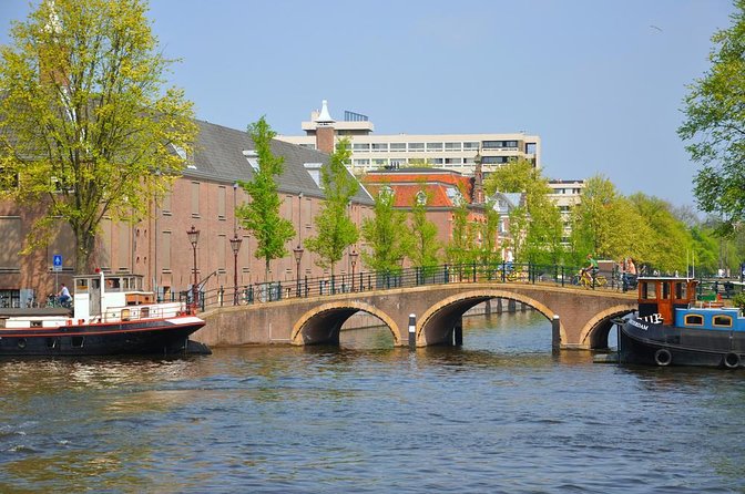 Amsterdam: Historic City Sightseeing Canal Cruise - The canal houses and smaller waterways