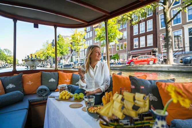 Amsterdam Historic Tour On Classic Saloon Boat - Rain, Visibility, and Seating Expectations