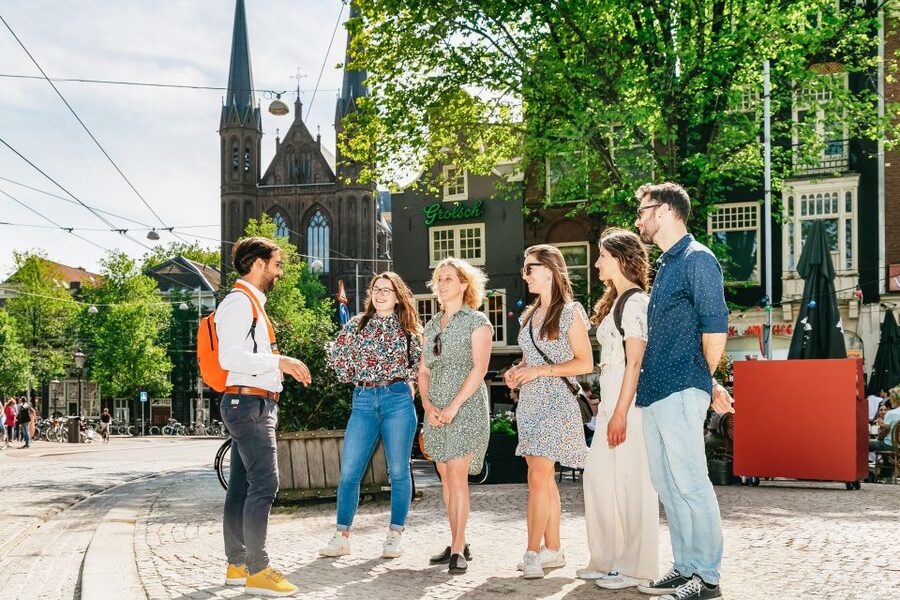 Amsterdam: Historical Highlights Walking Tour with Tasting - Following the Amstel River toward the city’s roots
