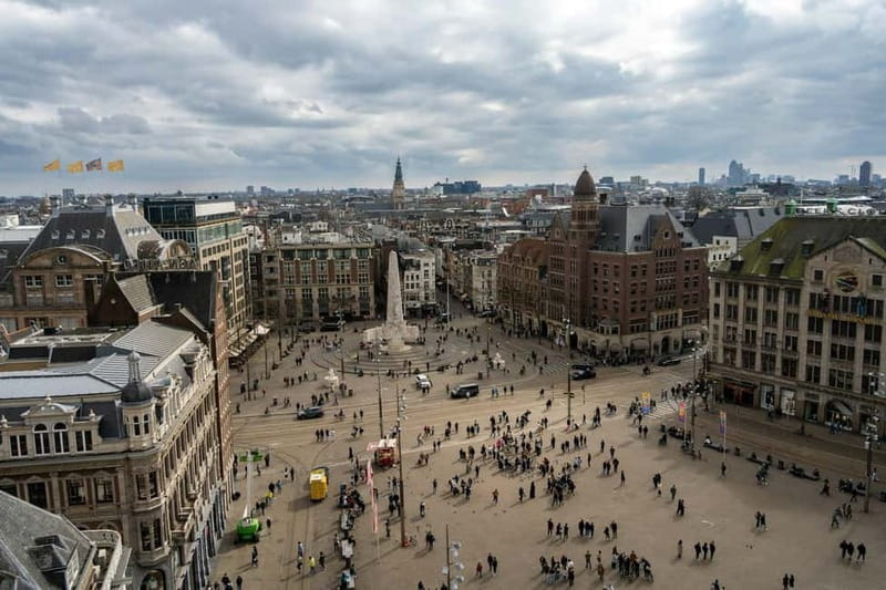 Amsterdam: Iconic Canals & Historic Sights Walking Tour - Meeting at Dam Square and the National Monument