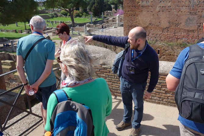 Ancient Ostia Antica Semi-Private Day Trip from Rome by Train with Guide - The Baths of Neptune and Roman public life