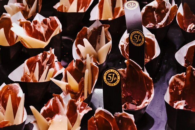 Barcelona Tapas Walking Tour: Food, Wine & History - Stop one: starting near Carrer de la Boqueria