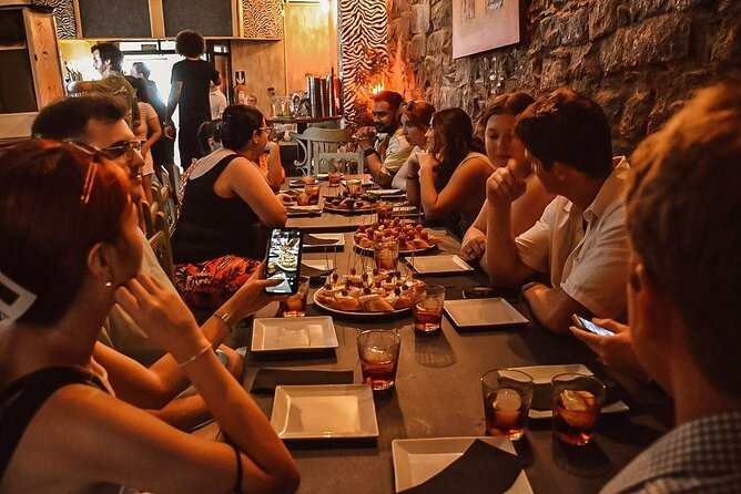 Barcelona Tapas Walking Tour: Food, Wine & History - Stop three: the private kitchen and paella