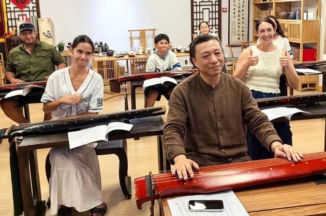 Beijing Culture: Tea Ceremony, Heritage Instrument & Calligraphy - Traditional clothing adds ceremony, but it is optional in spirit