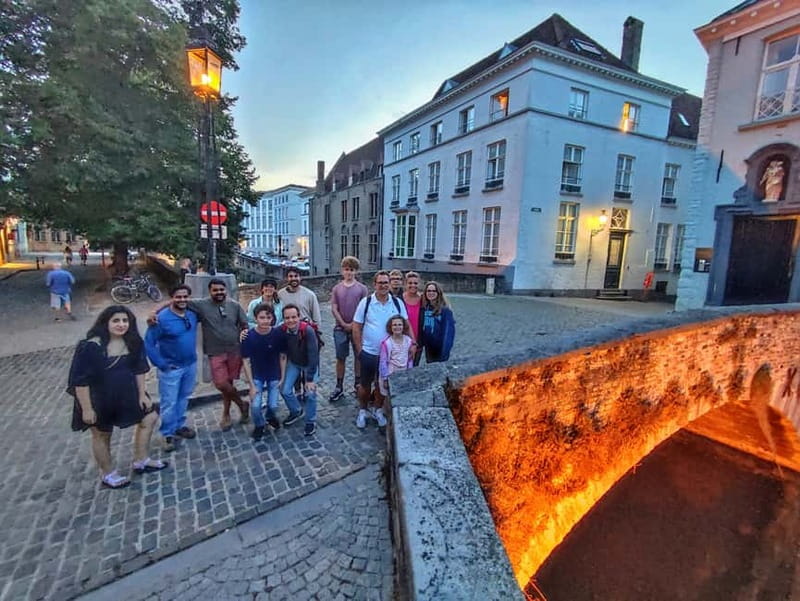 Bruges: Nightly Tales and Untold History Walking Tour - From beer and chocolate to the old trading quarter