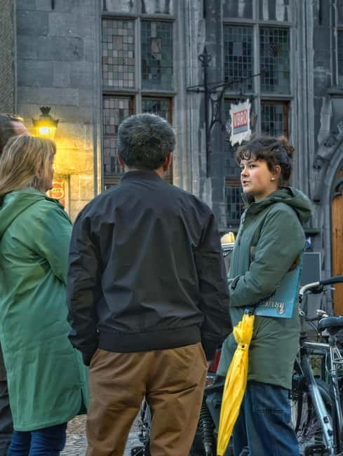 Bruges: Nightly Tales and Untold History Walking Tour - Vlamingstraat, Potterierei, and the quieter canals