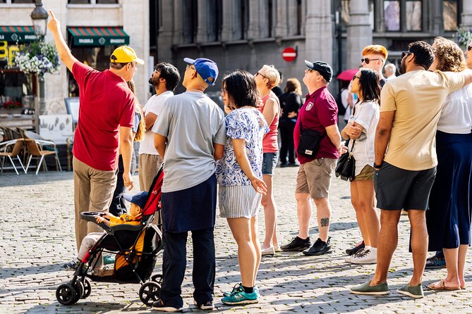 Brussels: Historical Walking Tour with Chocolate & Waffle Tasting - Starting beneath the Grand Place facades