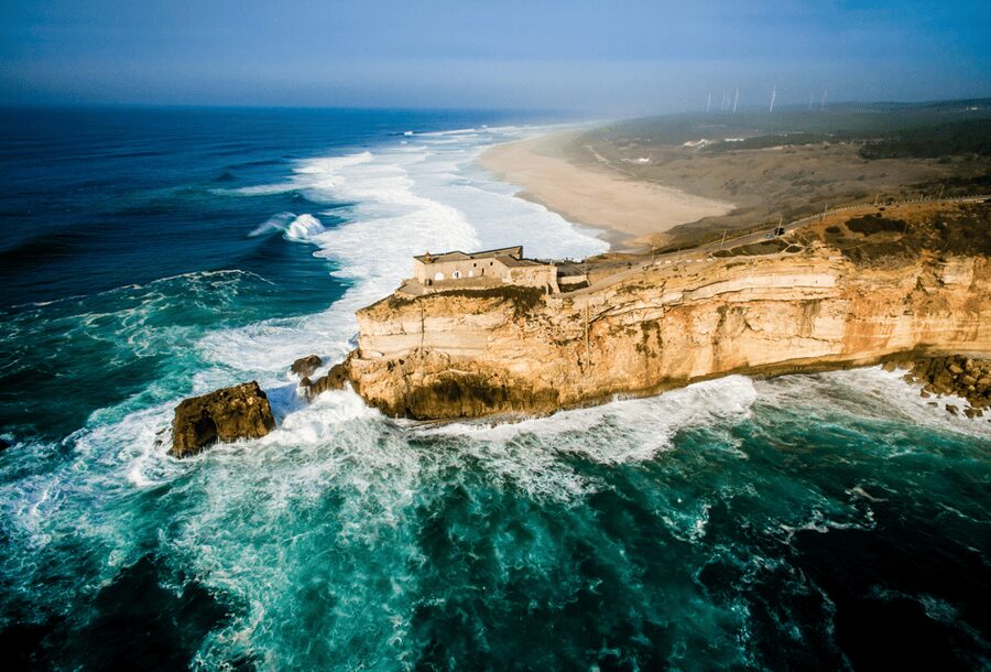 From Lisbon: Tour to Óbidos and Nazaré - Medieval Village, Ginja, and Giant Waves - Entering Óbidos through the castle walls