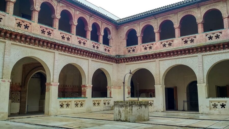 From Seville: Italica Roman City & Medieval Monastery Tour - Walking through Italica’s ancient streets