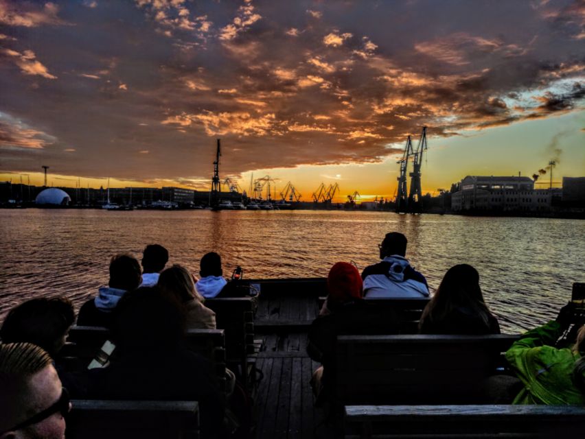 Gdańsk: Sunset Cruise on a Historic Polish Boat - The guide’s role and the atmosphere on board
