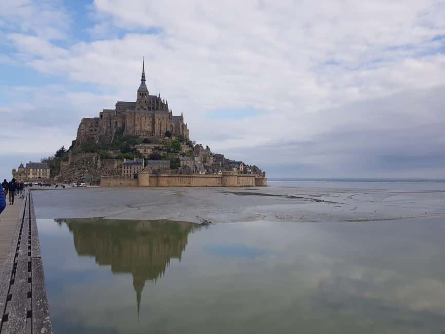 Mont Saint Michel: Village History and Legends Walking Tour - Starting at the shuttle and crossing toward the island