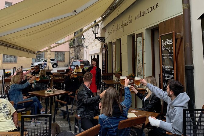 Prague Historic Pub Tour with Drinks Included - Old Town Square, films, and a second drink