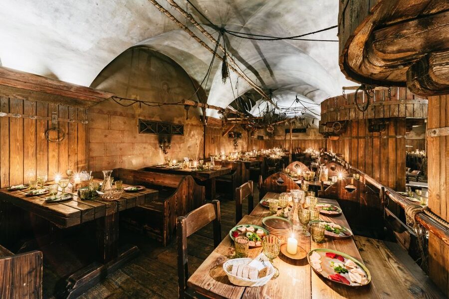 Prague: Medieval Dinner with Unlimited Drinks - Shared tables, small spaces, and practical comfort