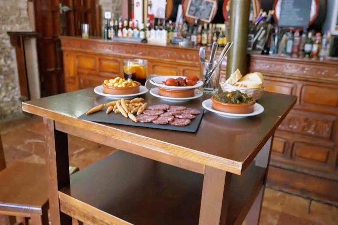 Sevilla Food Tour: Tapas, Wine, History & Traditions - Alfalfa, tostas, and old-style neighborhood life