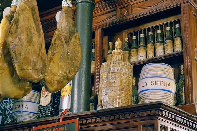 Sevilla Food Tour: Tapas, Wine, History & Traditions - Santa Cruz, a family tavern, and dessert