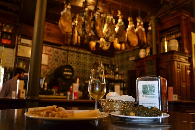 Sevilla Food Tour: Tapas, Wine, History & Traditions - Flamenco dress at Plaza del Pan