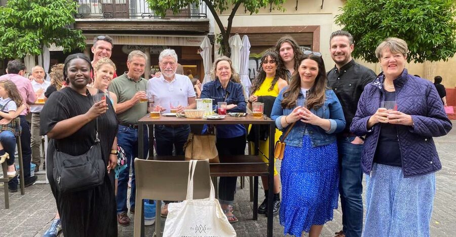 Seville: Tapas, Taverns, and History Walking Tour - The first stop: flaming chorizo and vermouth from the barrel
