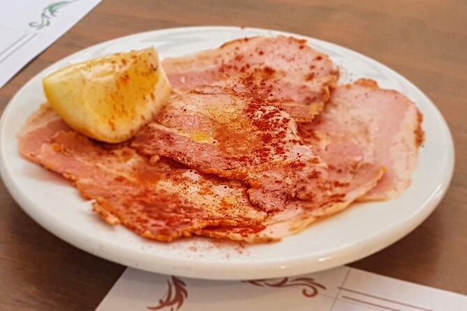 Taste of Malaga Tour : Tapas, History and Local Customs - The traditional ultramarinos and Iberian ham
